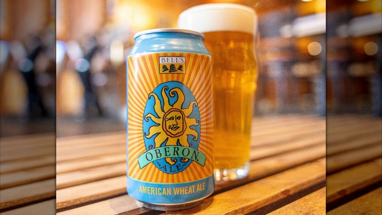Can and glass of Oberon on slat wood table