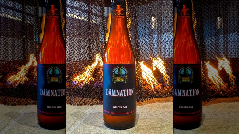 Bottle of Damnation on stone and fireplace
