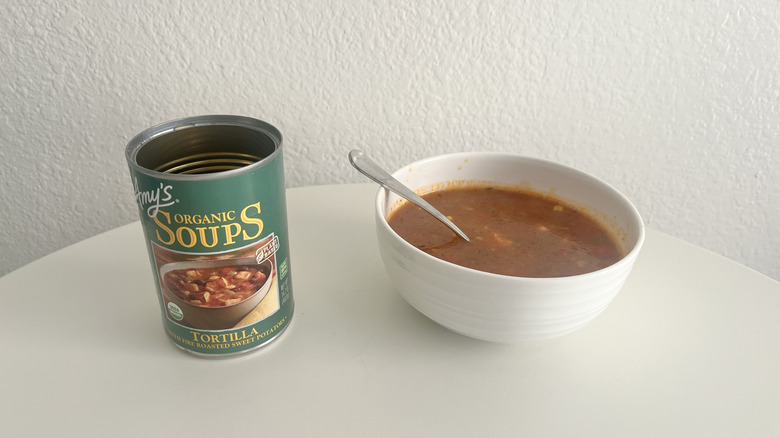 Open can of tortilla soup on a table
