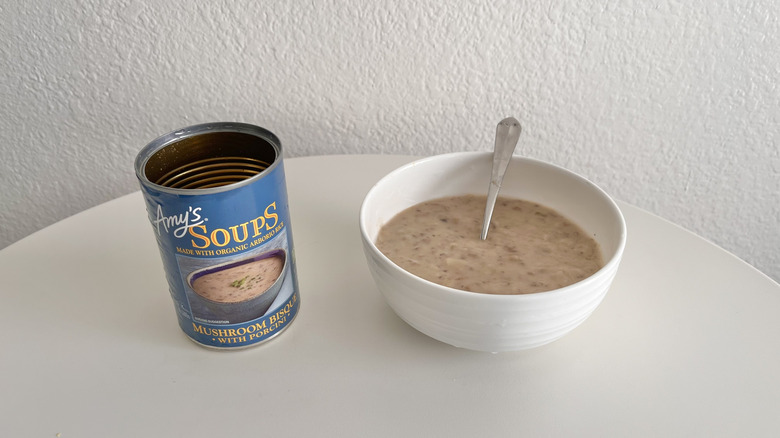 Blue can of mushroom bisque soup on a table