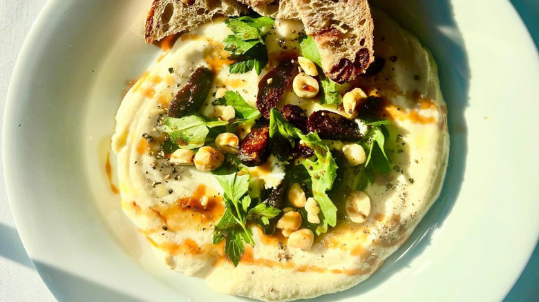 Plated whipped ricotta, mission figs, and toast at Jack Fry's