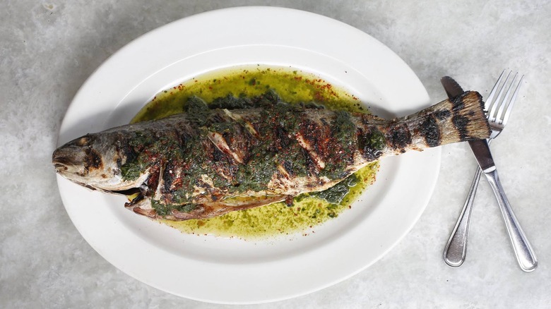 Grilled fish on a plate at Pêche Seafood Grill