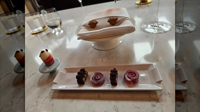 Four neatly plated desserts at Victoria & Albert's