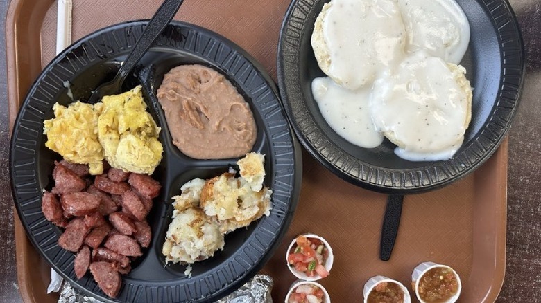 a tray with plates of barbecue food