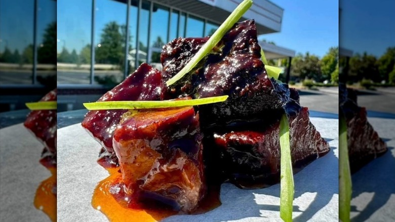 close up of barbecue burnt ends with sauce