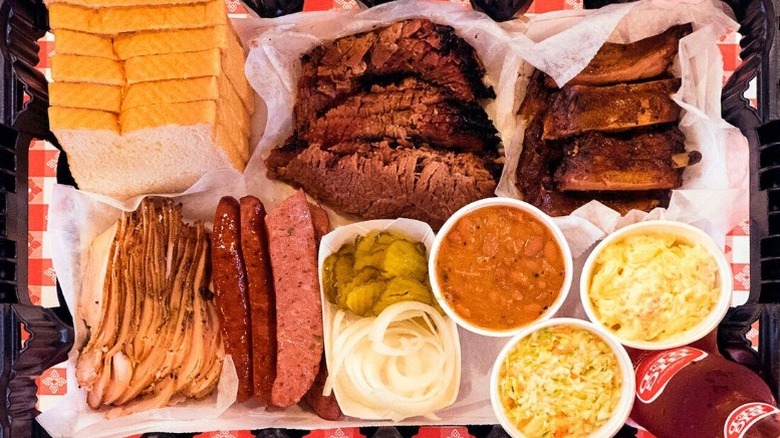 large tray full of a variety of barbecue foods