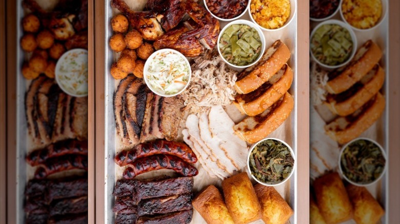 large tray of a wide variety of barbecue foods