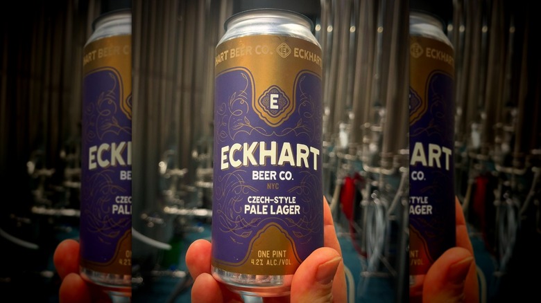 Hand holding a can of Czech-style pale lager