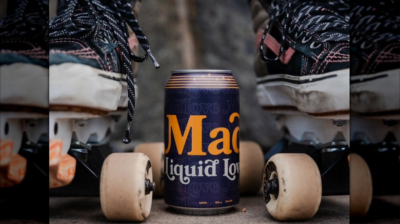 Can of Liquid Love between roller skates