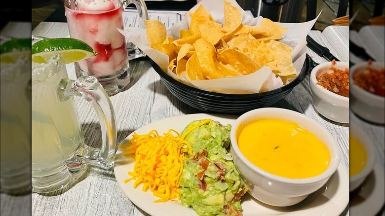 Nachos, salsa, guac, and queso