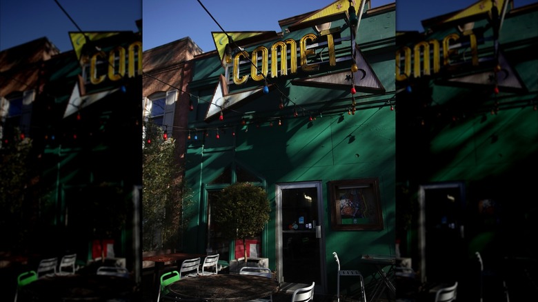 The sign and front entrance of Comet Ping Pong pizzeria are seen on Connecticut Avenue