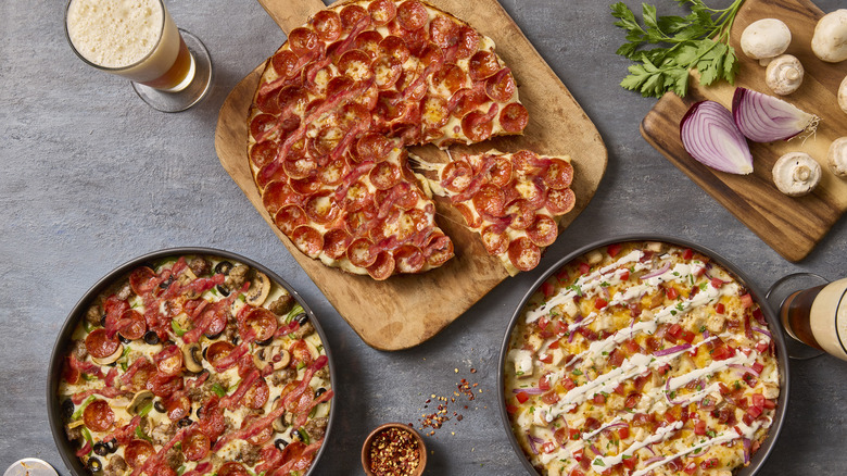 Three deep dish pizzas from BJ's Restaurant & Brewhouse