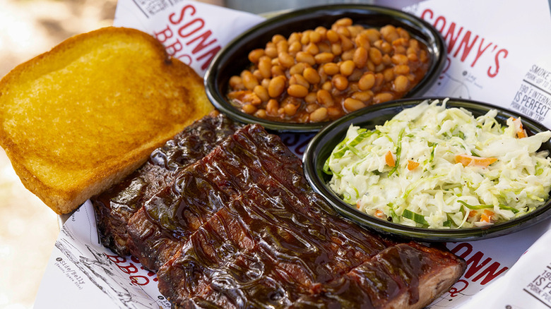 Sonny's BBQ St. Louis Rib dinner with ribs, garlic toast, beans, and coleslaw