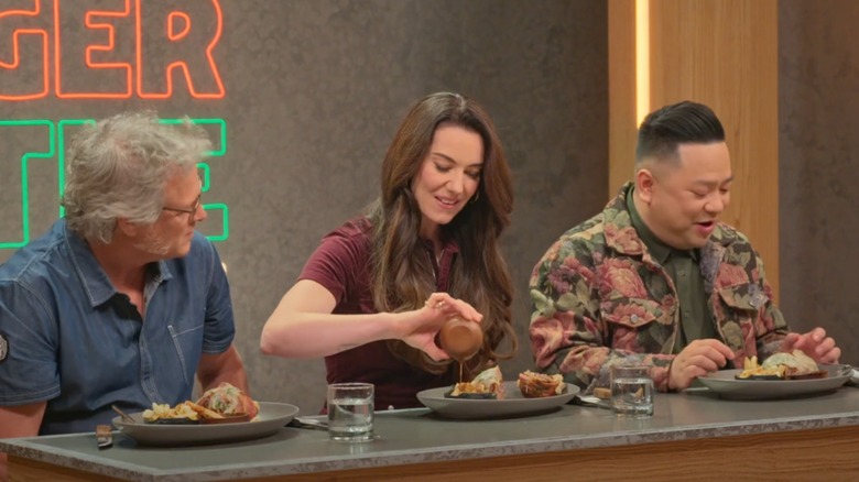 Andrew Phung and judges sampling burgers