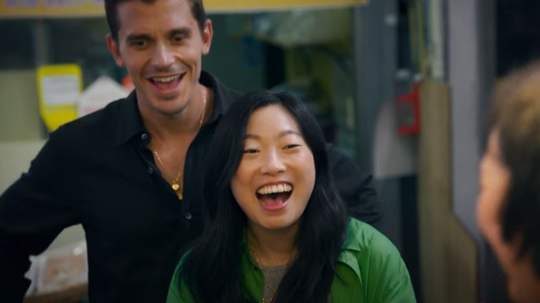 Antoni Porowski and Awkwafina laughing