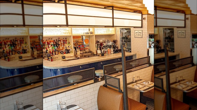 Interior at Old John's restaurants in NYC with a bar and a seating area