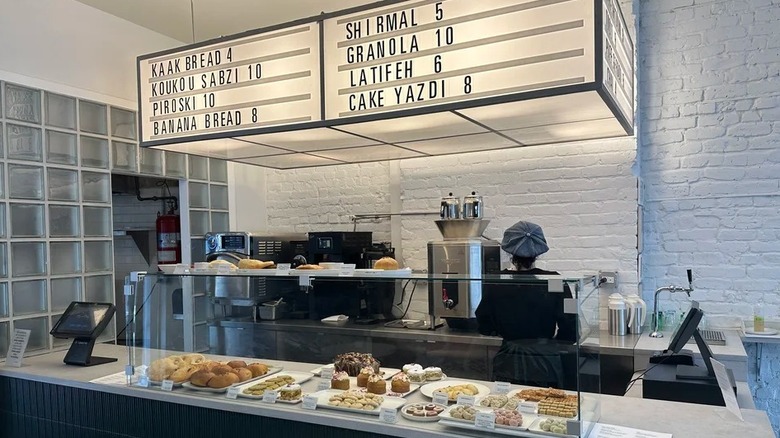 Counter at Sofreh cafe in NYC with menu above