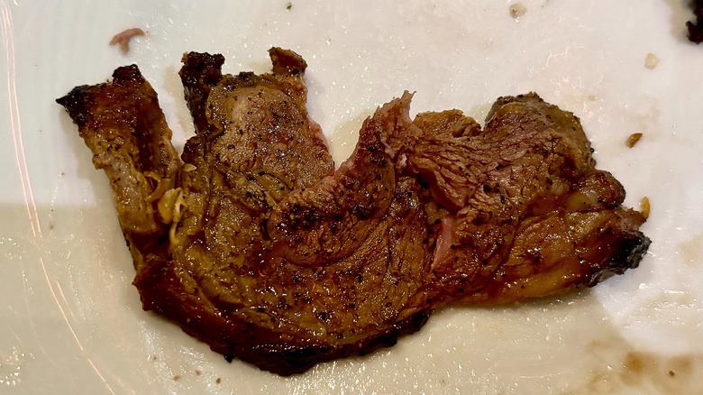 Lamb on white plate at Fogo de Chão