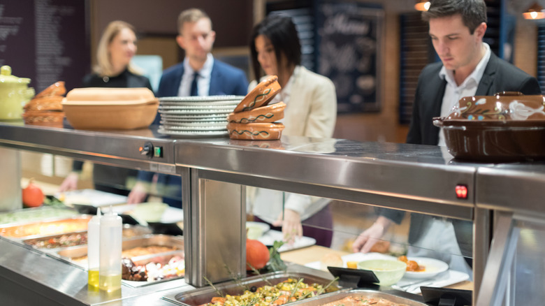 Customers starting at a cafeteria line