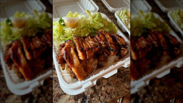Chicken teriyaki and salad in a takeout container