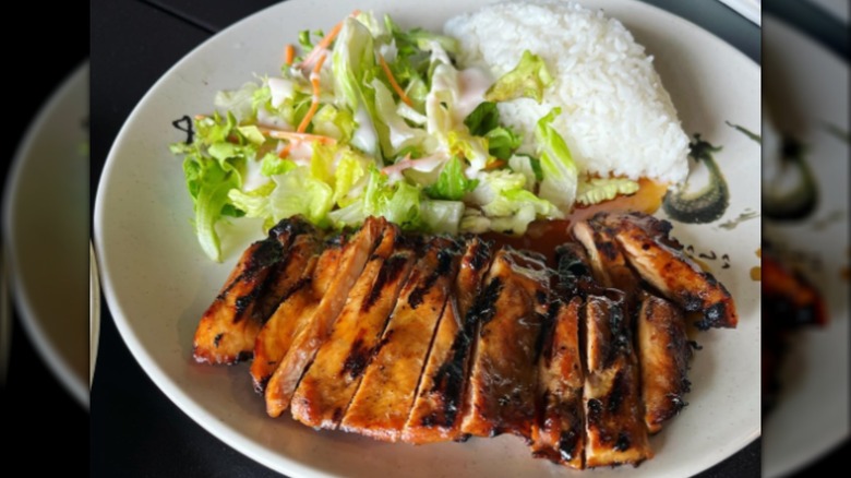 Plate of chicken teriyaki, salad, and rice