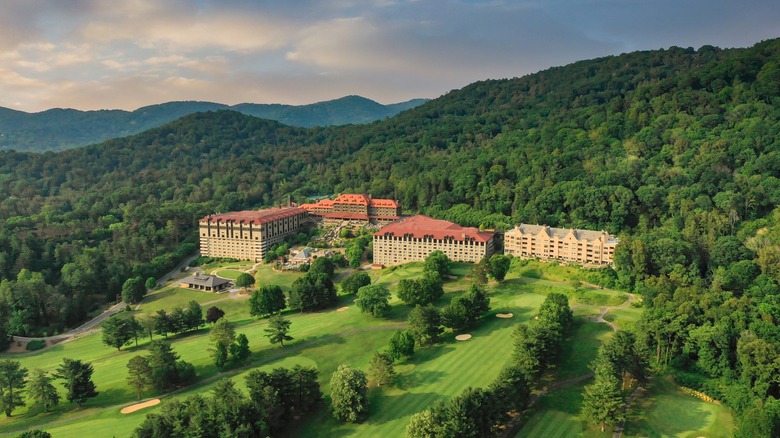 View of Omni Grove Park Inn & Spa surrounded by a green landscape