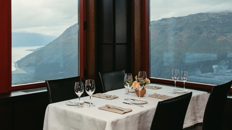 Corner table for four with large windows overlooking the glaciers at Seven Glaciers Restaurant