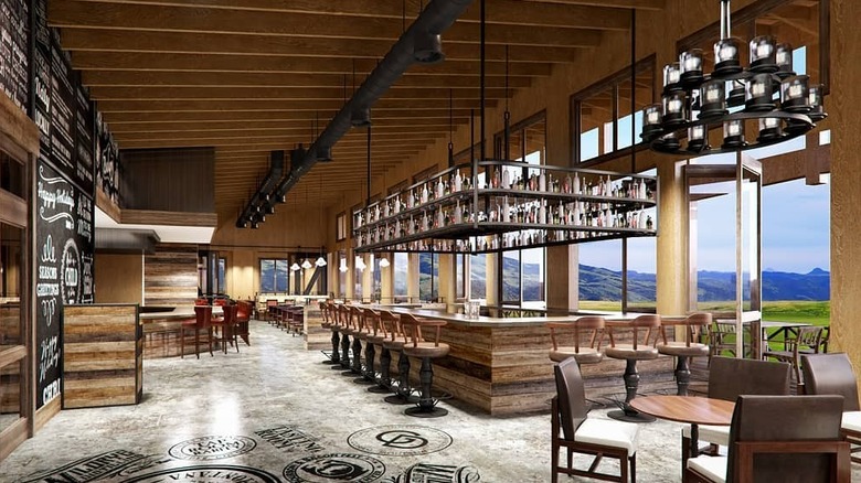 The Grill at Sage Lodge's spacious wooden interior with bar and mountain views