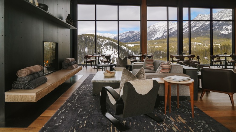 Interior of The Landing with fireplace and large windows and mountain view