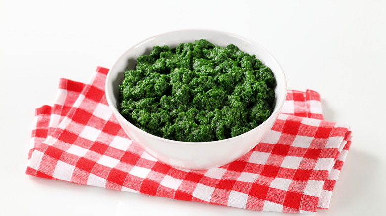 White bowl with spinach puree 