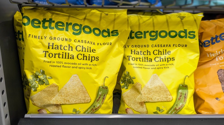 Two yellow bags of hatch chile chips on a shelf at Walmart