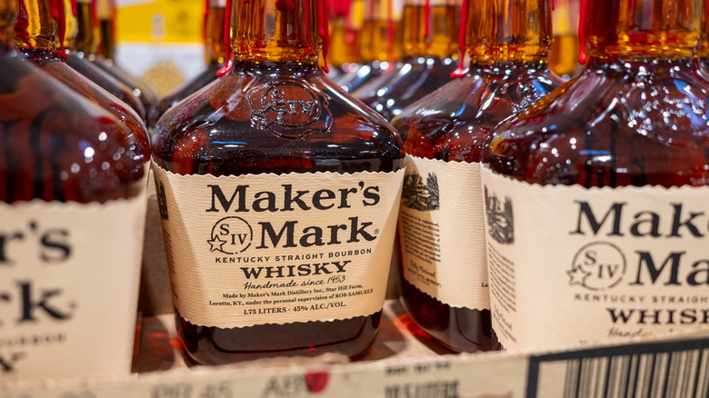 Several bottles of Maker's Mark bourbon shown on a liquor store shelf