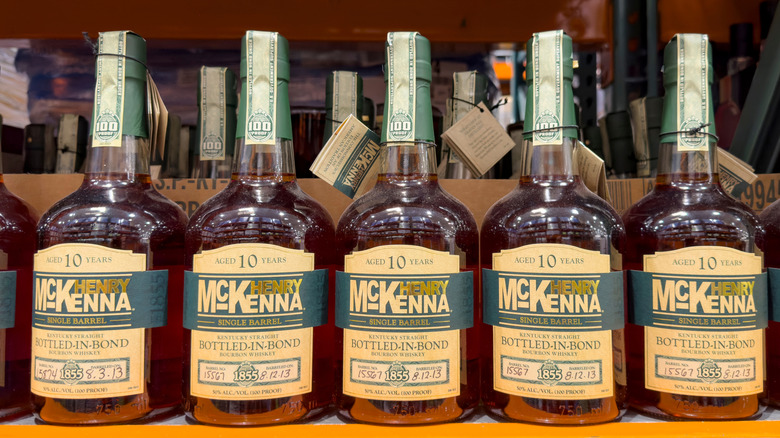 A row of Henry McKenna 10-Year Bottled-in-Bond bottles in a liquor store