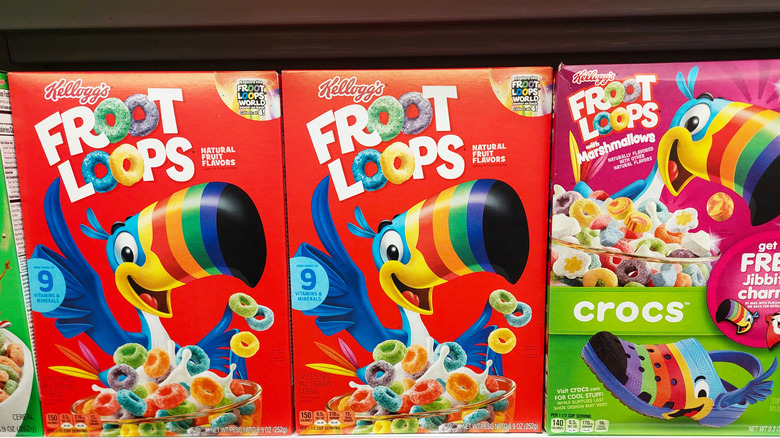 Three boxes of Froot Loops cereal in a row.
