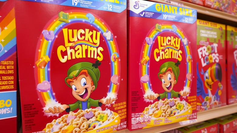 Red boxes of Lucky Charms cereal in the store.