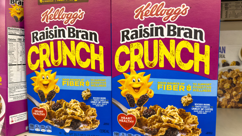 Two boxes of Raisin Bran Crunch cereal.