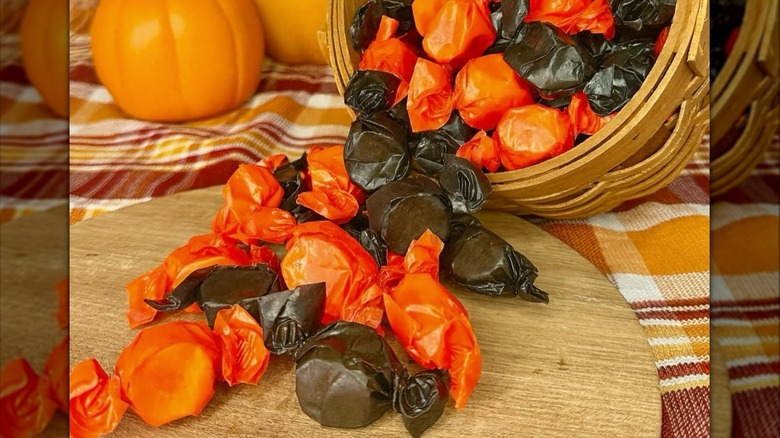 Bunch of molasses taffy beside pumpkins