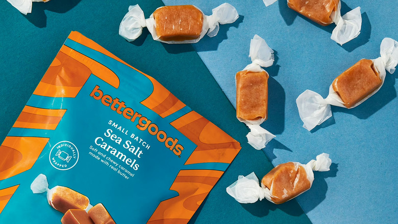 A bag of Bettergoods caramel candy, pictured alongside the individually wrapped candy.