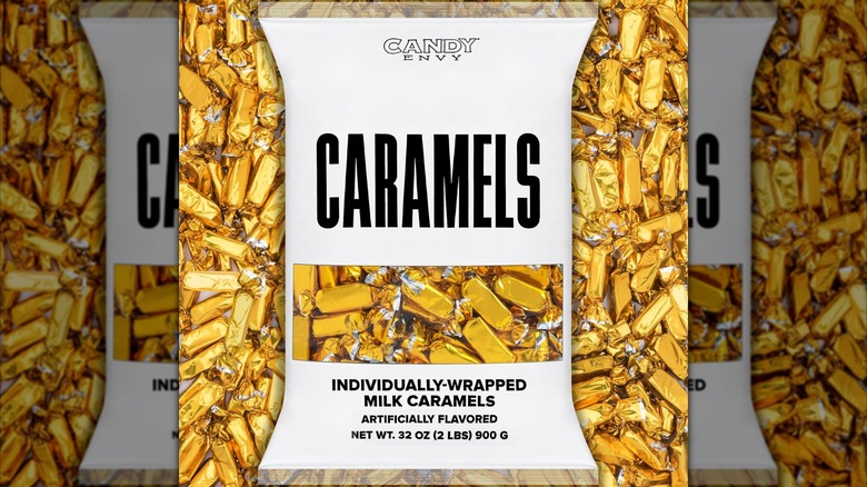 Image of a Candy Envy bag of caramels, filled and surrounded by gold-wrapped candy.