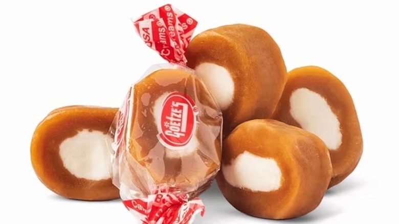 Goetze's Caramel Creams candy, one in a wrapper and four unwrapped.