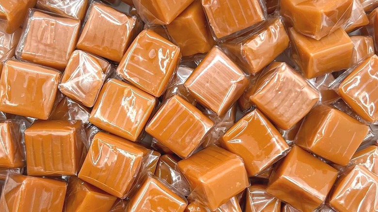Individually wrapped squares of caramel candy.