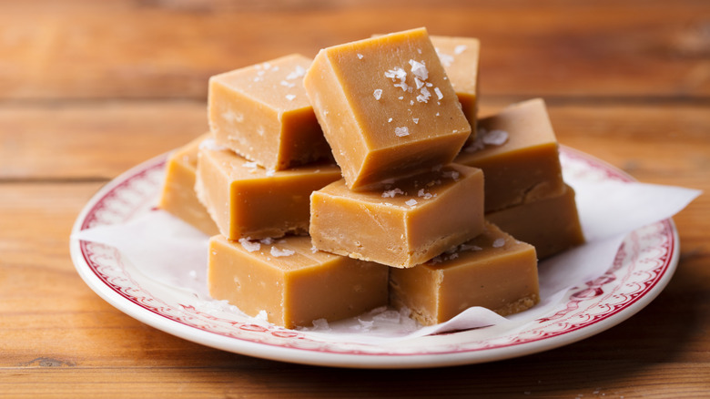 Square caramel fudge-like candies topped with salt.