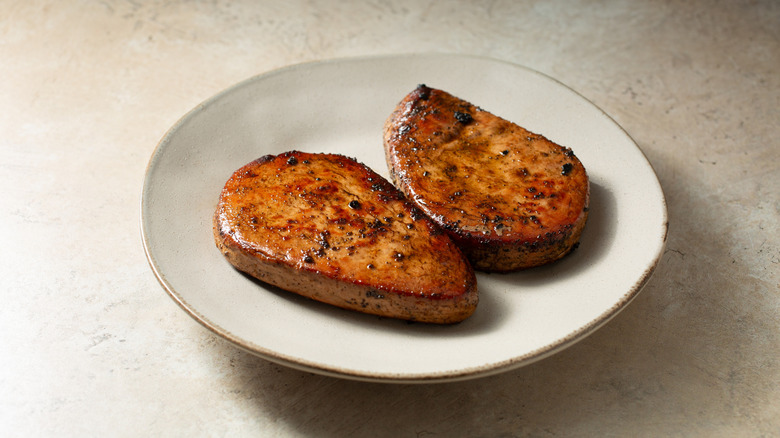 Two mushroom steaks on a plate