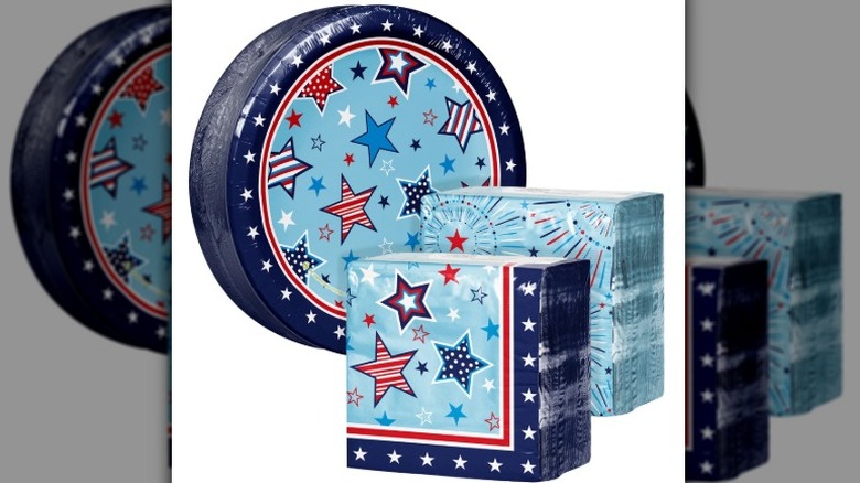 Artstyle star spangled line of red, white, and blue paper plates and napkins on a white background