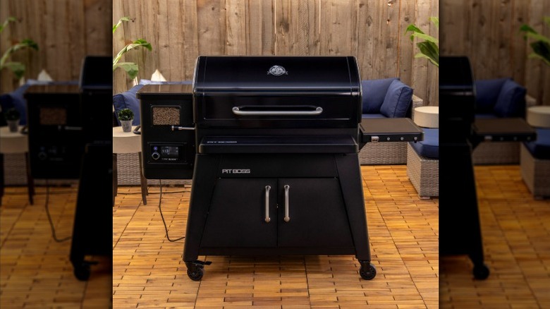 The Pit Boss Heritage wood pellet grill on a tiled patio
