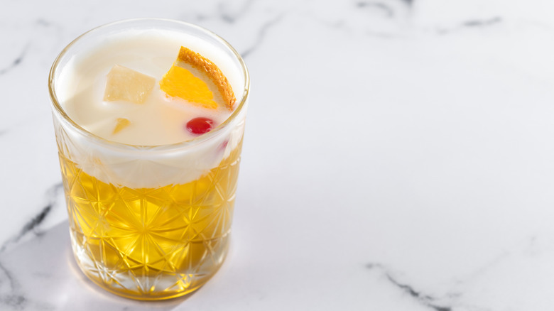 whiskey sour poured in glass