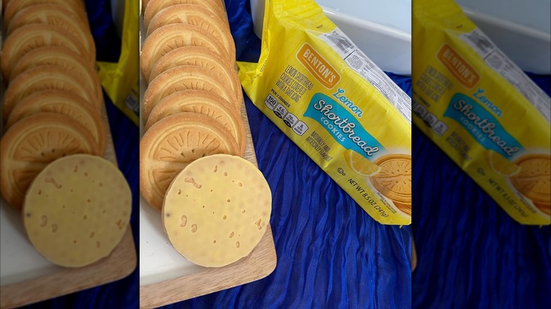 A close-up photo of Benton's Lemon Shortbread Cookies arranged in a line next to the product's packaging