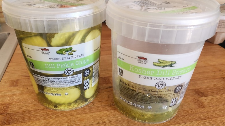 Two plastic jars of Park Street Deli kosher dill spears