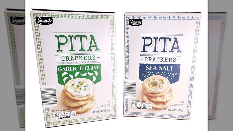 Two cartons of Savoritz Pita Crackers side by side, one Garlic & Chive and the other Sea Salt