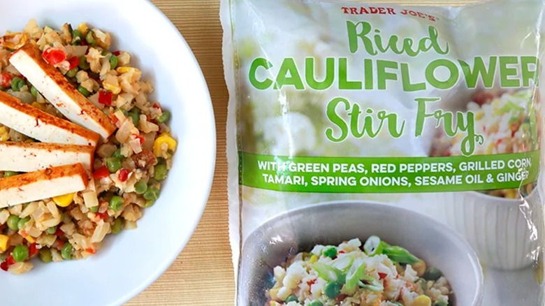 Trader Joe's Riced Cauliflower Stir Fry bag next to a prepared bowl